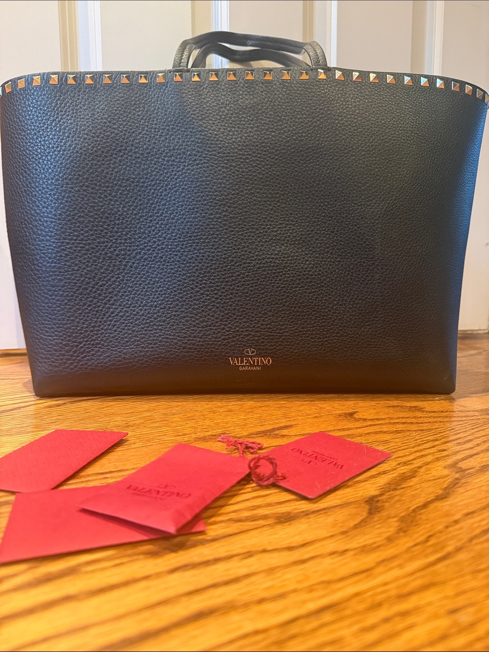 Valentino Garavani Black Pebbled Leather Tote with Gold Pyramid Studs